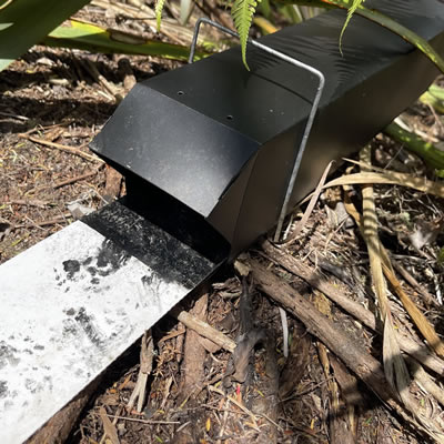 Black Trakka Tracking Tunnel in the bush showing ink card and tunnel stay.